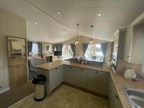 Indulgence lakeside lodge i1 with hot tub, private fishing peg situated at Tattershall Lakes Country Park