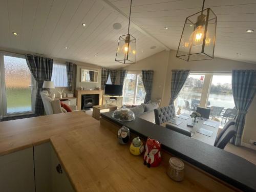 Indulgence lakeside lodge i1 with hot tub, private fishing peg situated at Tattershall Lakes Country Park