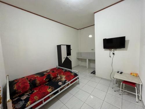 . Adonara Kost Bau Bau