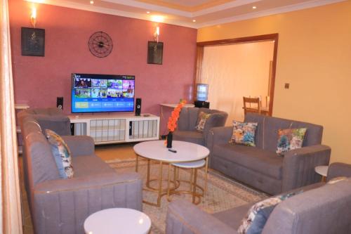 Shared lounge/TV area, The Glamour House in Ruiru