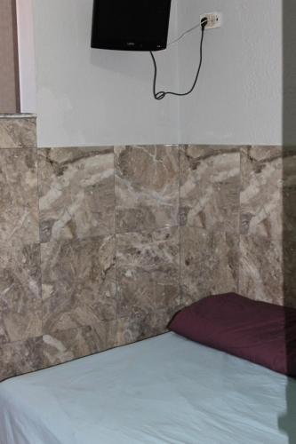 Camera singola, bagno in comune