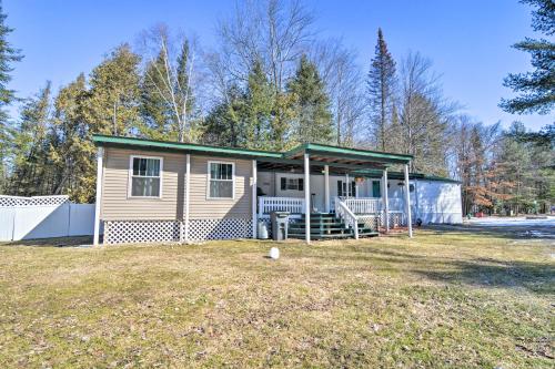 Houghton Lake Area Home with Fire Pit and Yard!