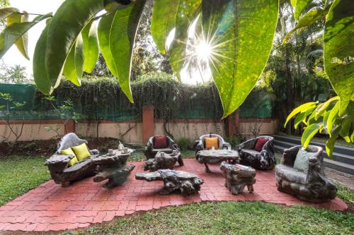 Saffronstays Casa Del Palms, Alibaug - luxury pool villa with chic interiors, alfresco dining and island bar