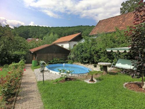 Holiday home in Thuringia with private terrace, use of a garden and pool