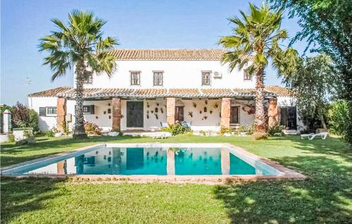 . Nice home in Coria del Río with Outdoor swimming pool and 4 Bedrooms