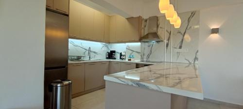 주방, Atlas By Sea Apartment in 오아시스 (로우트라키 페라코라)