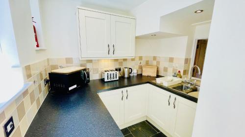 Exterior view, Out To Sea - Stunning views, elevated position with onsite parking in Dartmouth