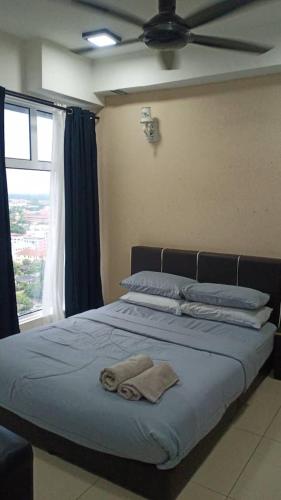 a bedroom with a bed and a window, Staycity Apartment - D'Perdana Sri Cemerlang in Kota Bharu