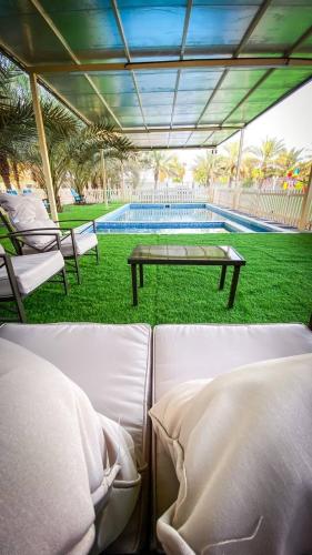 Swimming pool, Palm Escape Farmhouse - By Seven Elements in Khatt