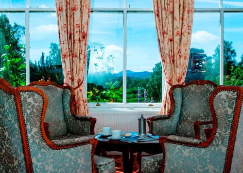 ห้องส่วนกลางสำหรับนั่งเล่น/ดูทีวี, โรงแรมโคลเฮ้าส์ (Coul House Hotel) in สเตร็ปเฟฟเฟอร์