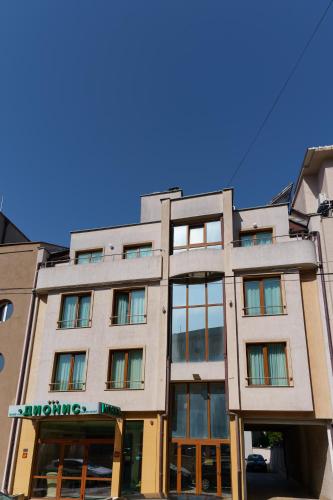 Dionis Hotel - Tap to explore photos