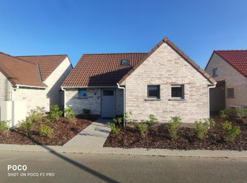 入口, Vakantiewoning Polderhuis 10, airco en verwarming in alle kamers, prive parkeerplaats en afgesloten  in 科克賽德