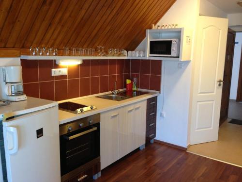 Kitchen, Lovagvar Apartments in Gyula