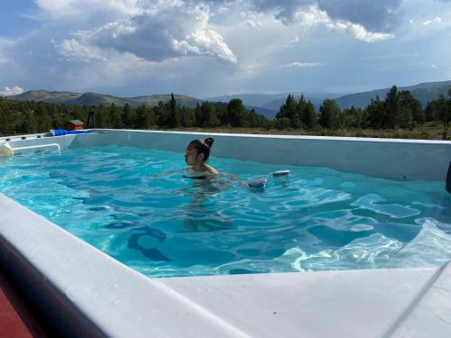 泳池, Trollvang, hytte med pool og sauna in 賀夫靈恩