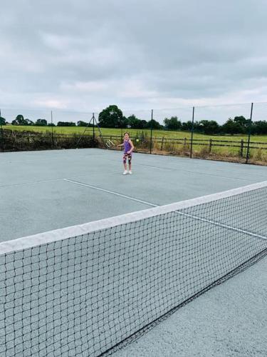 The Granary at Pentregaer Ucha, tennis court & lake.