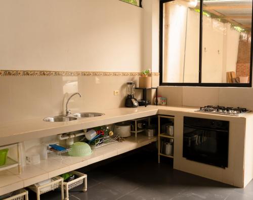 Cucina, RinaKawsay - ViveViajando Apartamento amoblado en Tena in Tena