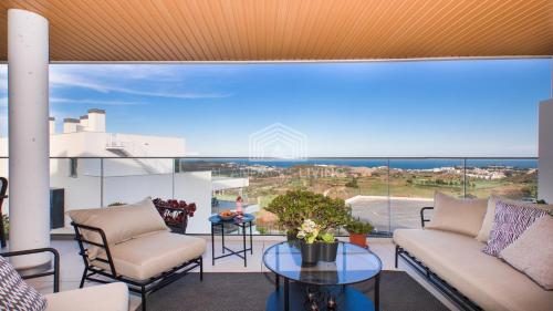 Luxury new built contemporary apartment with panoramic sea and golf view in upper La Cala de Mijas