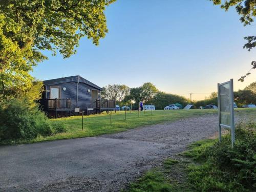 Shepherds hut surrounded by fields and the Jurassic coast