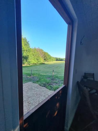 Shepherds hut surrounded by fields and the Jurassic coast