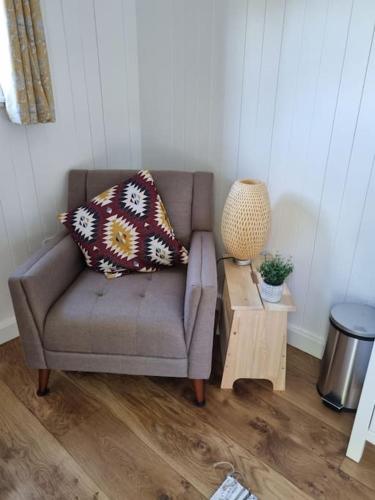 Shepherds hut surrounded by fields and the Jurassic coast