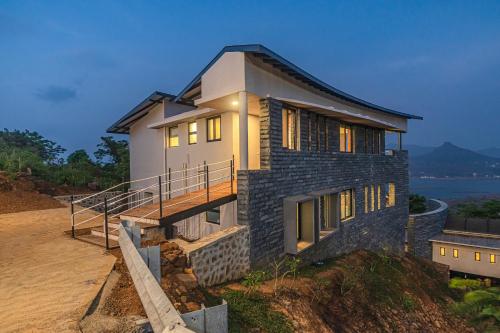 Exterior view, SaffronStays Ahilya Waters - 3BR Pawna villa, infinity pool, 270 terrace views, bonfire & AD-feature in Kolechafesar