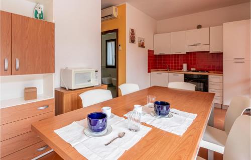 Amazing Home In Albarella Ro With Kitchen
