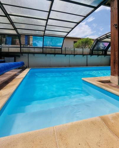 Villa climatisée 5 chambres avec Piscine couverte à 700 m de la plage gîte à louer Lacanau-Océan
