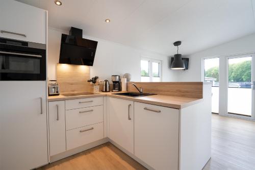 Kitchen, Ferienhaus "TO HUUS" mit kostenfreier Saunanutzung in Haffkrug