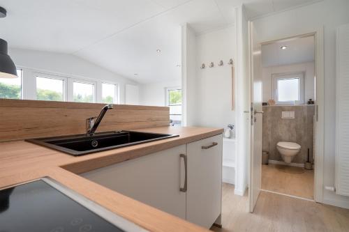 Kitchen, Ferienhaus "TO HUUS" mit kostenfreier Saunanutzung in Haffkrug