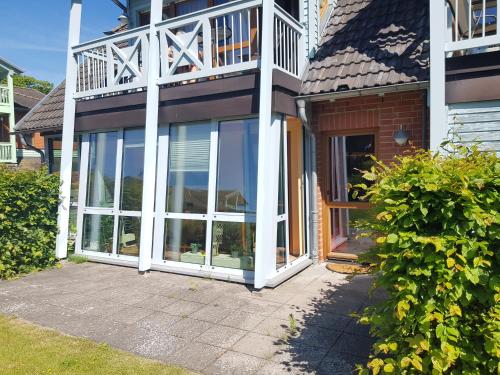 Exterior view, Ferienwohnung 2 im Haus am See mit Terrasse und Wintergarten in Altensien