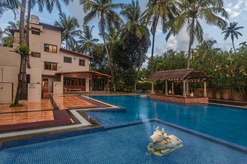 Saffronstays Casa Del Palms, Alibaug - luxury pool villa with chic interiors, alfresco dining and island bar