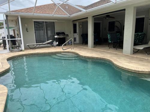 Swimming pool, Centrally-Located Charming Home With A Heated Pool in North Port (FL)