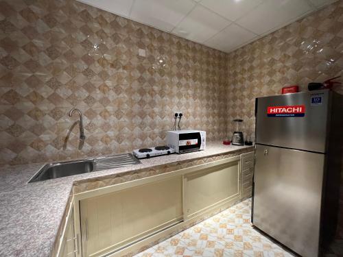 Kitchen, Aalia Hotel Suites in Al Multaqa