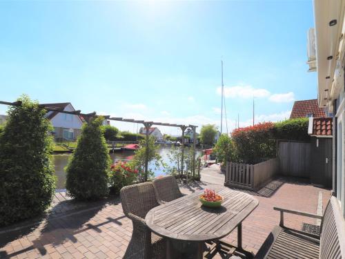  Detached vacation home in Friesland with waterfront views in Grou