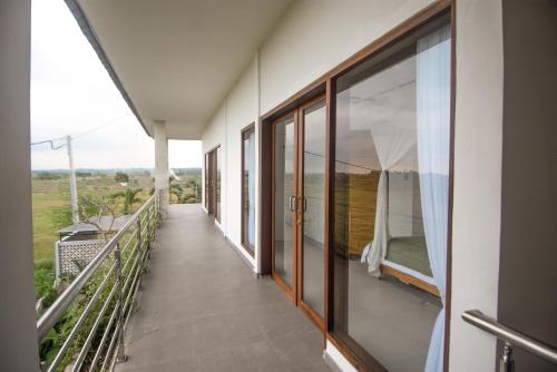 Balcony/terrace, Three Palms Surf & Stay Medewi near Pekutatan Beach