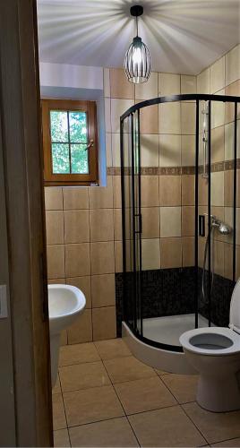 Zuhanyzó, Uroczy dom Wszebory in Tluszcz