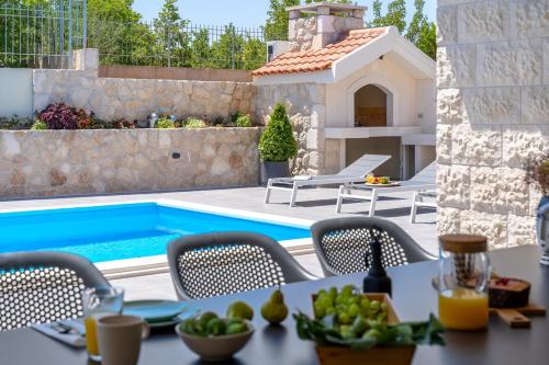 NEW! Stylish Villa Neven with 44sqm heated private pool, 4 en-suite bedrooms, 2 living and dining areas, wine cellar