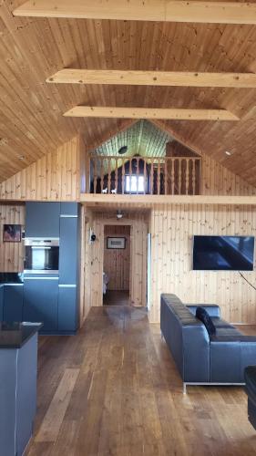Glass House with Private River & 360° Views in Arnarstapi