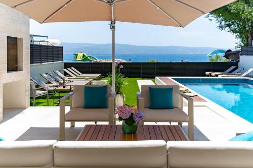 Beachfront Villa Erce with private 40sqm heated pool, a Gym, 7 en-suite bedrooms, a rooftop terrace, 2 living areas