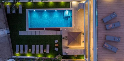 Beachfront Villa Erce with private 40sqm heated pool, a Gym, 7 en-suite bedrooms, a rooftop terrace, 2 living areas