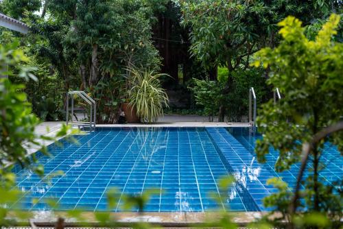 Swimming pool, Muntra Garden Resort in Sattahip Beach