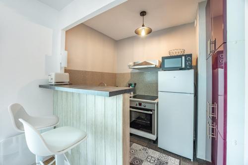 virtuve, La Tortue Joyeuse - Appartement avec Loggia in Bernieres-sur-Mer