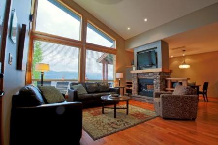 a living room filled with furniture and a fireplace, The Residences at Fairmont Ridge in Fairmont Hot Springs (BC)