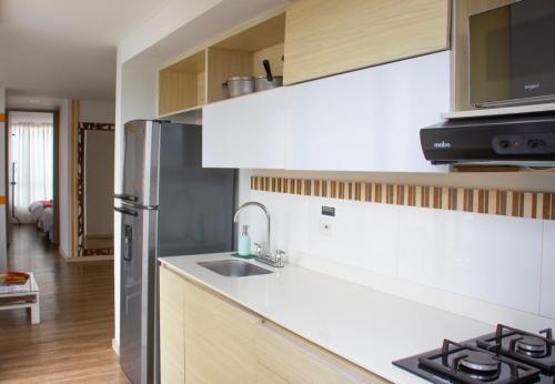 Kitchen, Apartahotel Millennials in Ecoturistico Cerro de Orro