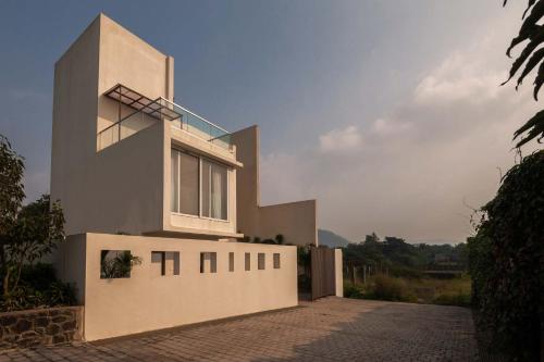 StayVista's Cascades - Mountain-View Villa with Pool, Deck & Balconies