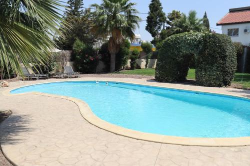 Mediterranean poolside garden cottage