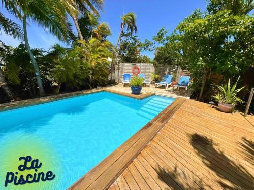 Swimming pool, Caraiba Villa & Bungalows in Sainte Anne