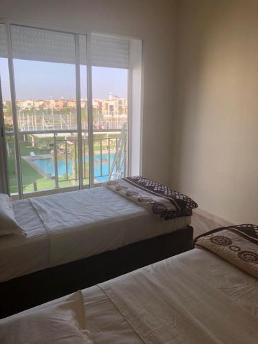 Bel appartement pied sur mer vue imprenable sur piscine et jardins in Sidi Rahal
