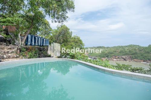 Swimming pool, Baron Hill Resort Gunung Kidul RedPartner near Ngrenehan Beach