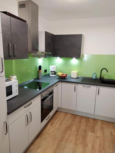 廚房, FeWo Wildflecken - Ferienwohnung Rhön Neubau 2021 (FeWo Wildflecken - Ferienwohnung Rhon Neubau 2021) in 比紹夫斯海姆a.d.力弘